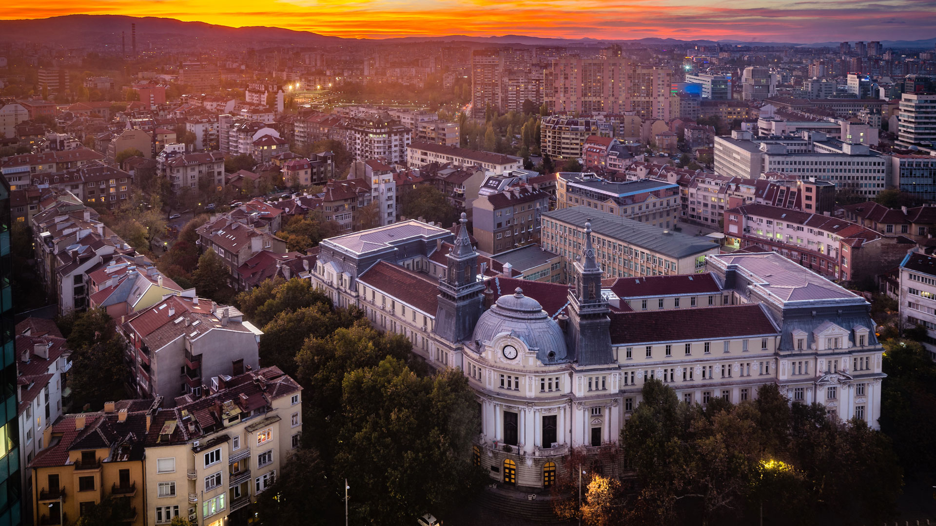 Panoramic high angle view above Western city of Sofia, Bulgaria, Eastern Europe during sunset back light into the sky. Shot on Canon EOS full frame system with tilt-shift prime lens, diversity, equity, and inclusion, dei, ekas