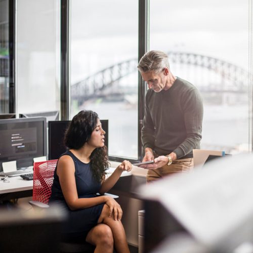 Business people in the office working with a digital tablet.